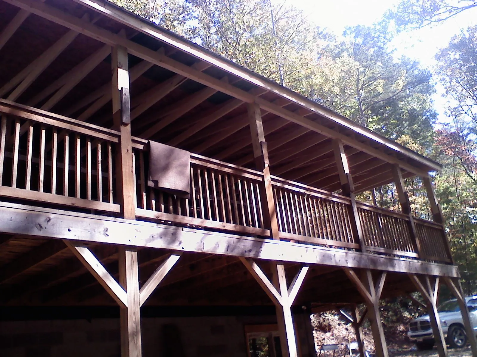Timber framing under a new elevated porch and deck — Roof Leak Repair in Saranac by Roofing Brothers